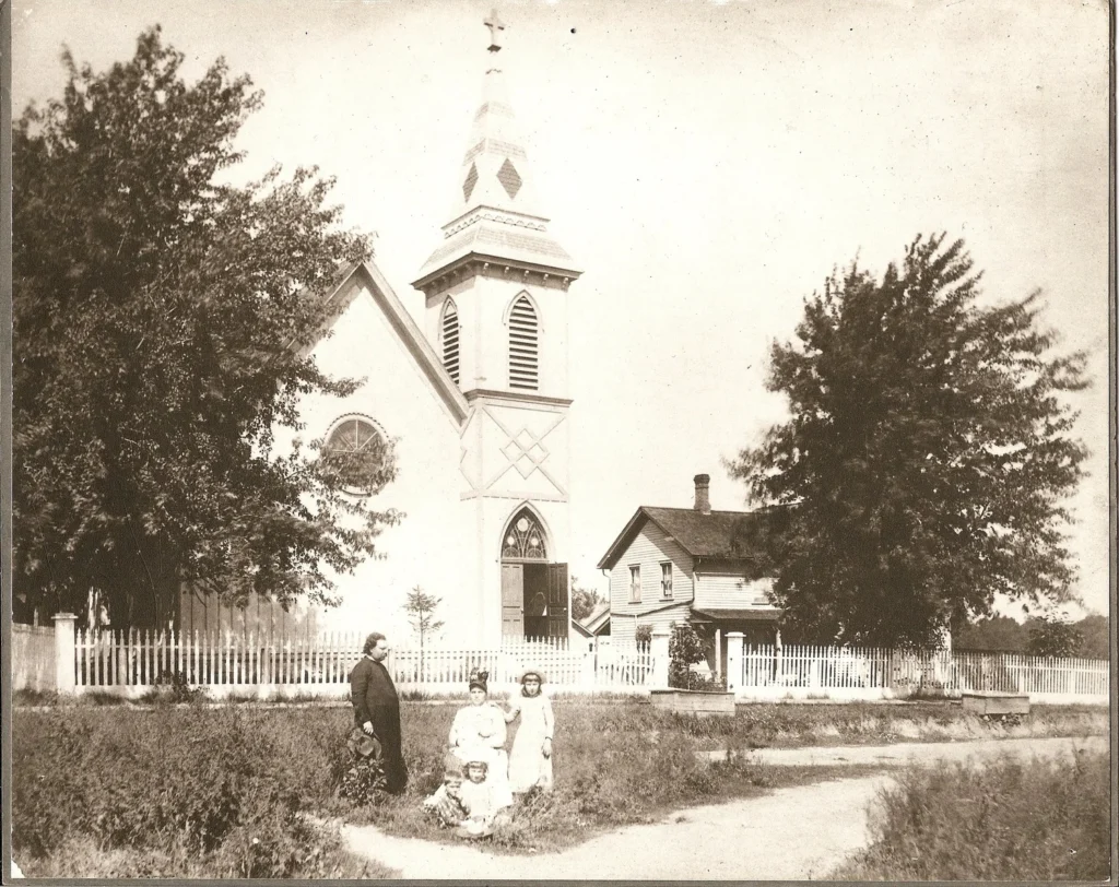 The Rev. Charles Hodge, wife Laura, and children Justin, Charles and Mary (in the lap of Laura) pose in front of Grace Church in this iconic photo from 1900 during Hodge’s second term as priest.