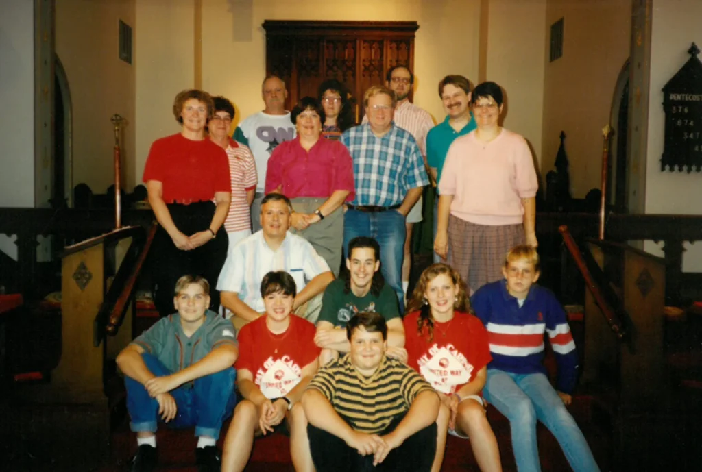 The Youth Group (E.Y.C.) of Grace New Lenox in the mid 1990s, pictured in the front with adult supervisors in the back.