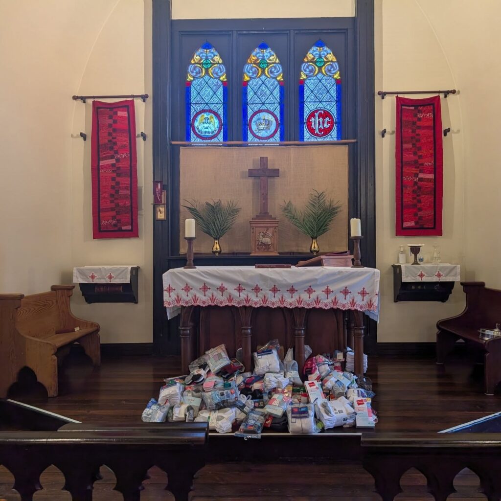 Donated socks piled in front of the altar at Grace Episcopal Church during a sock drive